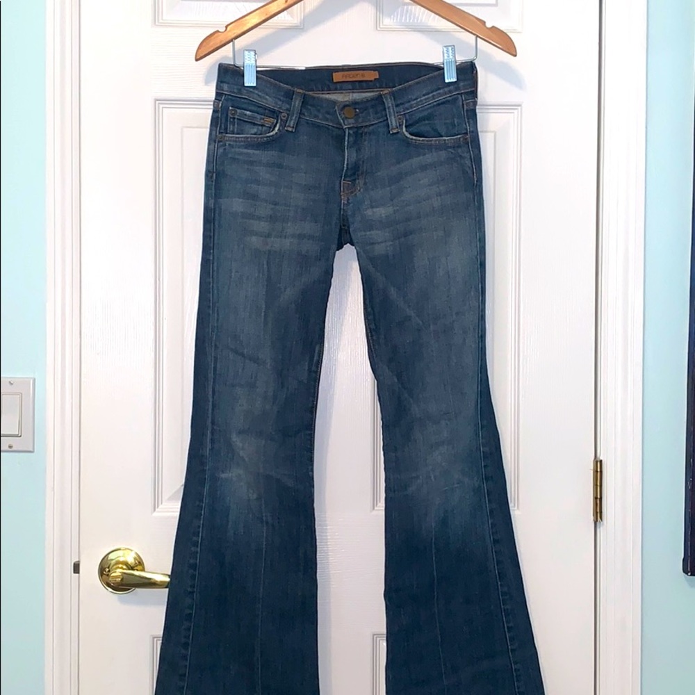 Flared cut low rise jeans.